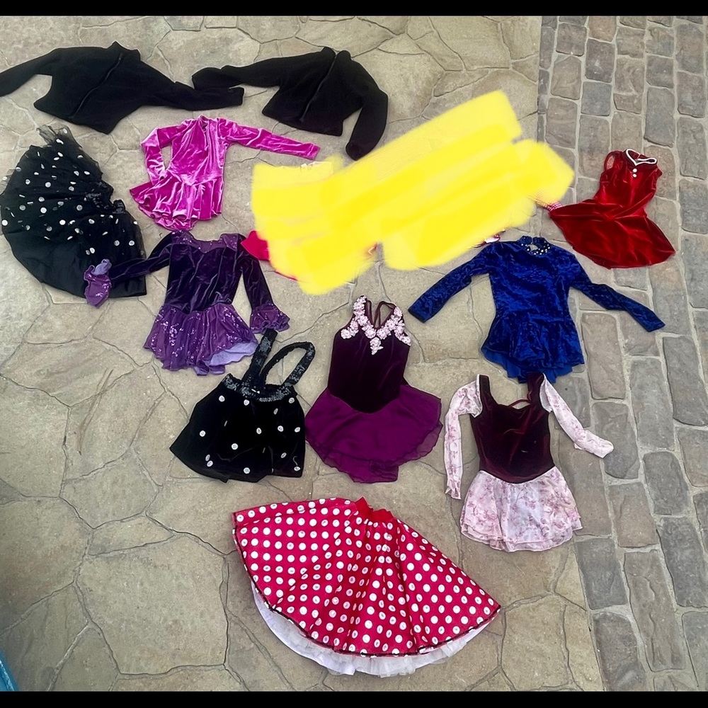 Lot of ice skating outfits ranging from child’s 6- 14.